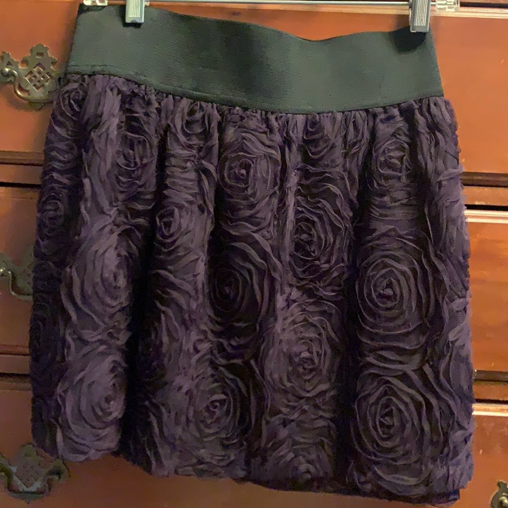 Purple rose pattern skirt with elastic waistband.